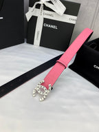 Pink Chanel belt with strap holes and round gold Chanel logo buckle