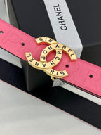 Pink Chanel belt close-up: embossed strap and gold circular Chanel logo buckle