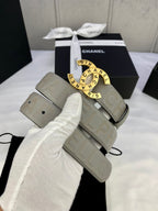 Light beige Chanel belt with circular logo buckle and embossed strap, in gift box