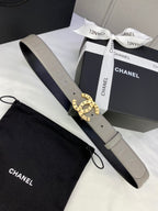 Beige Chanel belt with round logo buckle and adjustable embossed strap in box
