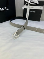 Beige Chanel belt with round logo buckle, embossed strap, laid with gift bag