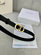 Black leather belt with gold-tone CD buckle, angled view
