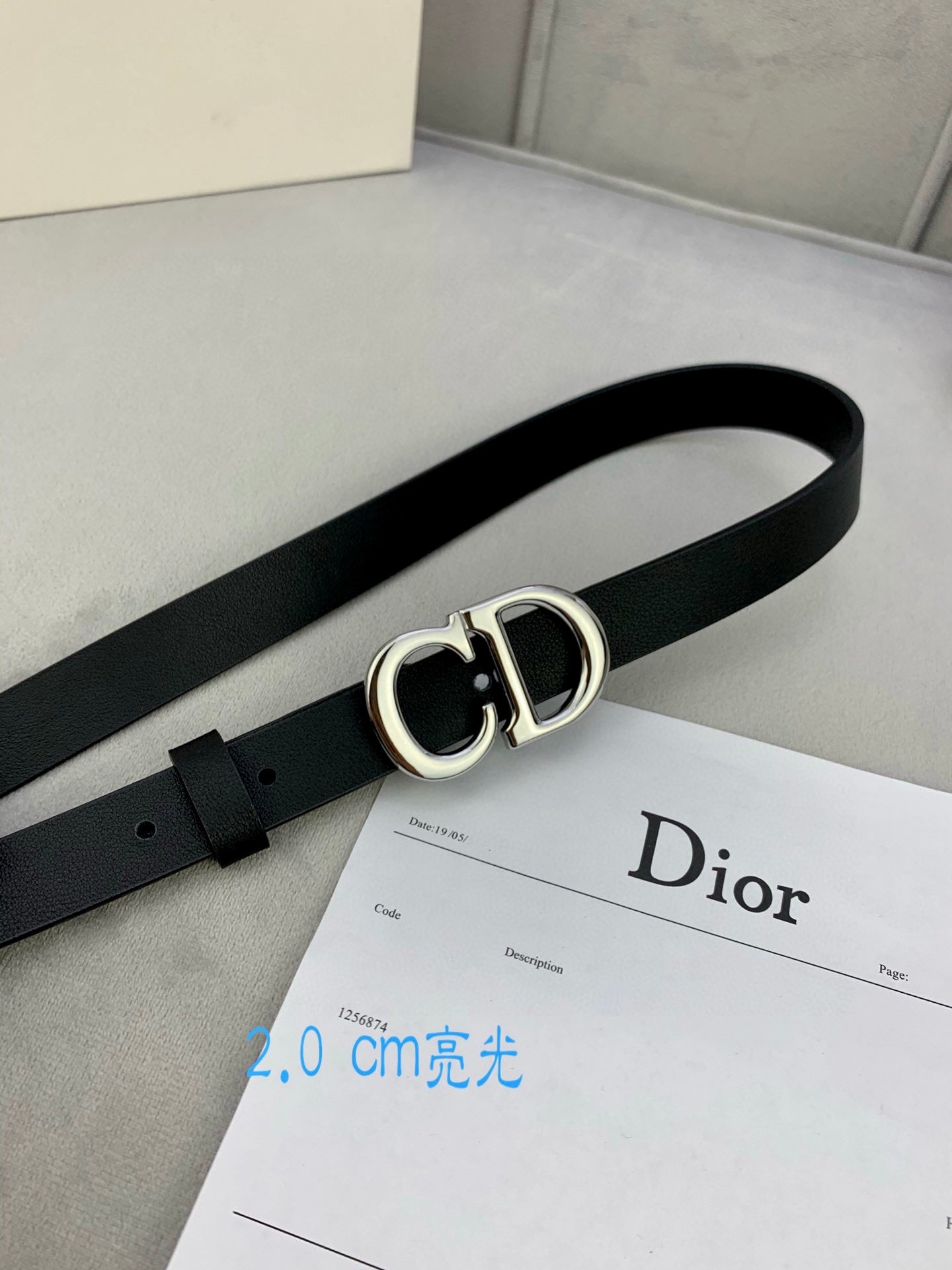 Black leather belt with silver-tone double D buckle