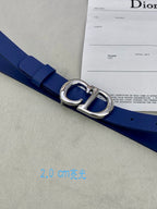 Blue Dior belt with silver-tone buckle and CD emblem, close-up detail.