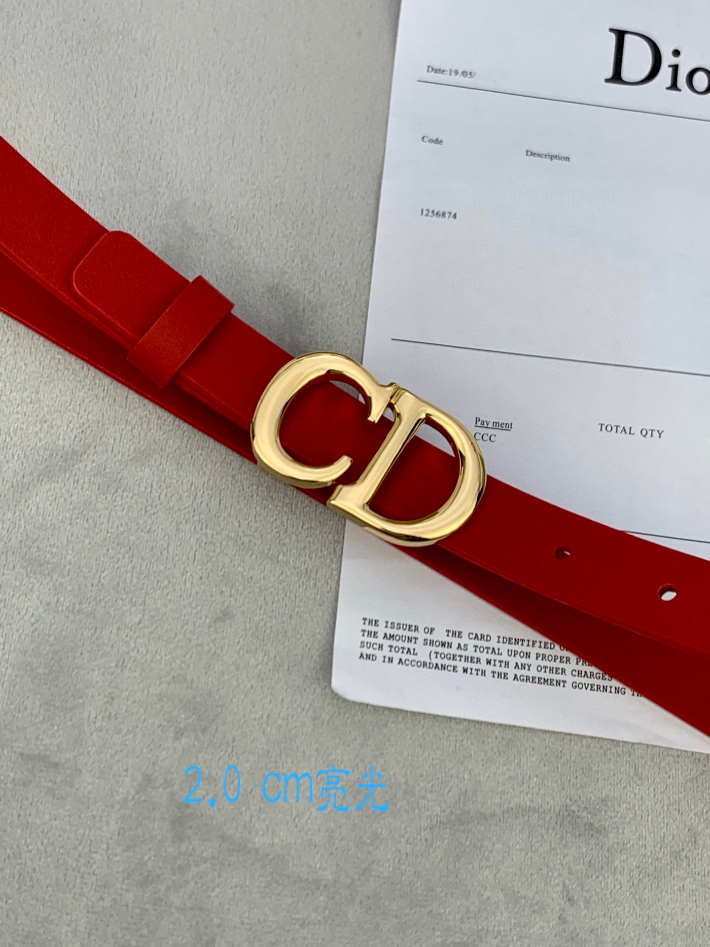 Dior red belt with CD buckle close-up