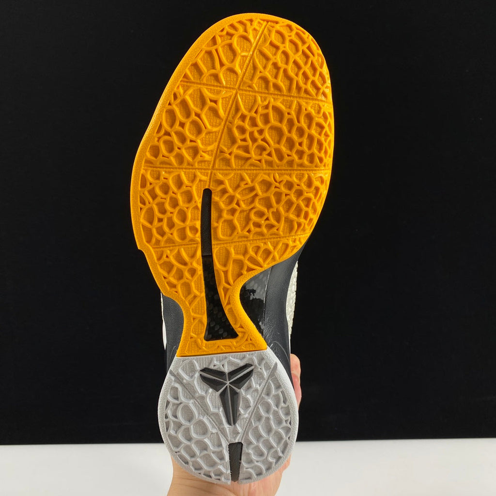Nike basketball shoe outsole with yellow traction tread and gray textured forefoot