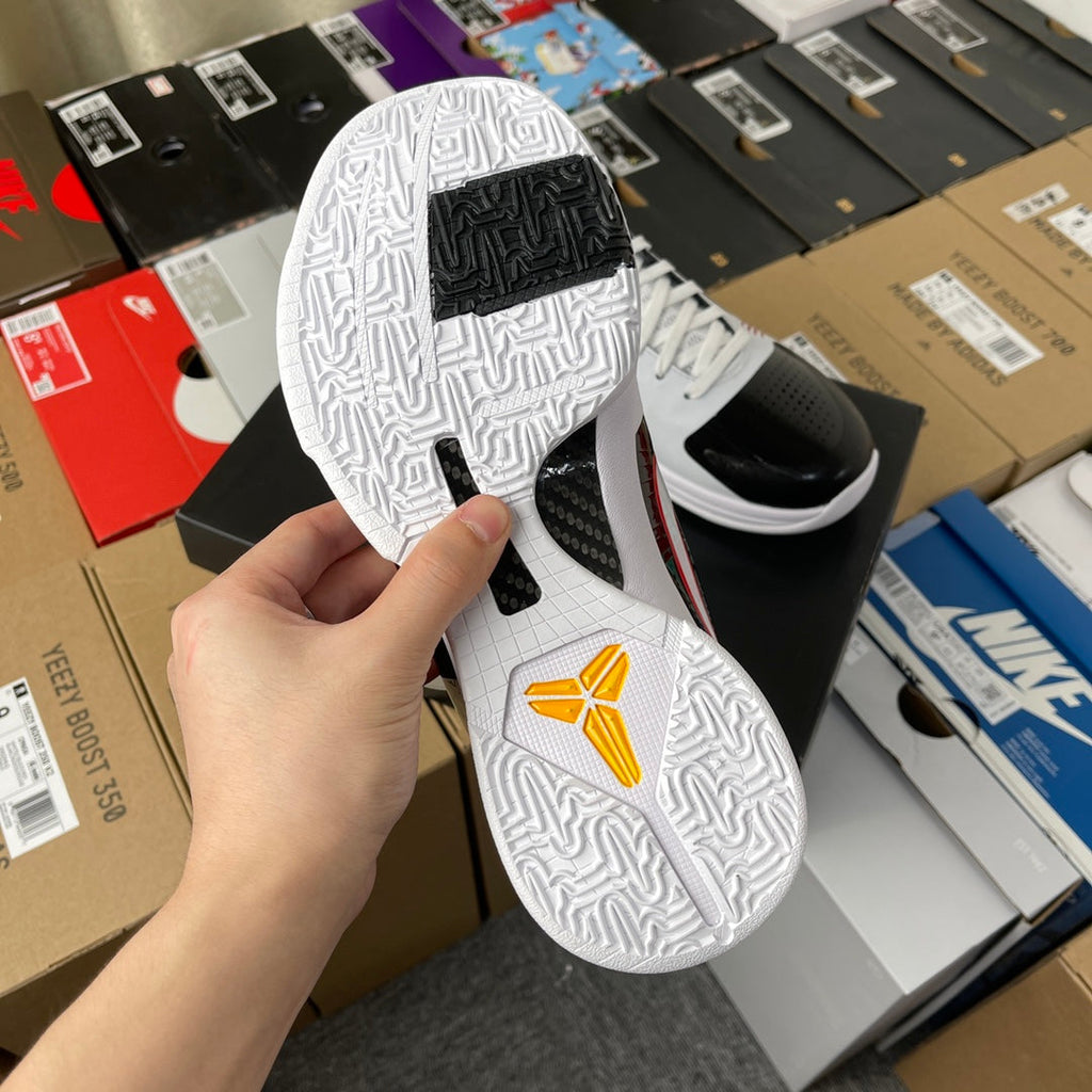 Nike Zoom Kobe 5 Protro basketball shoe, textured white outsole with yellow heel detail