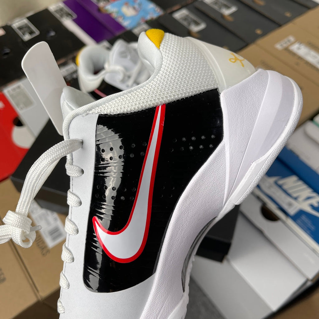 Nike Zoom Kobe 5 Protro basketball shoe, quilted white upper with black strap and red swoosh