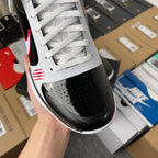 Nike Zoom Kobe 5 Protro basketball shoe, front/ankle view with white laces and black toe