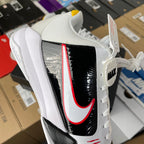 Nike Zoom Kobe 5 Protro basketball shoe, angled view with black glossy panel and red swoosh