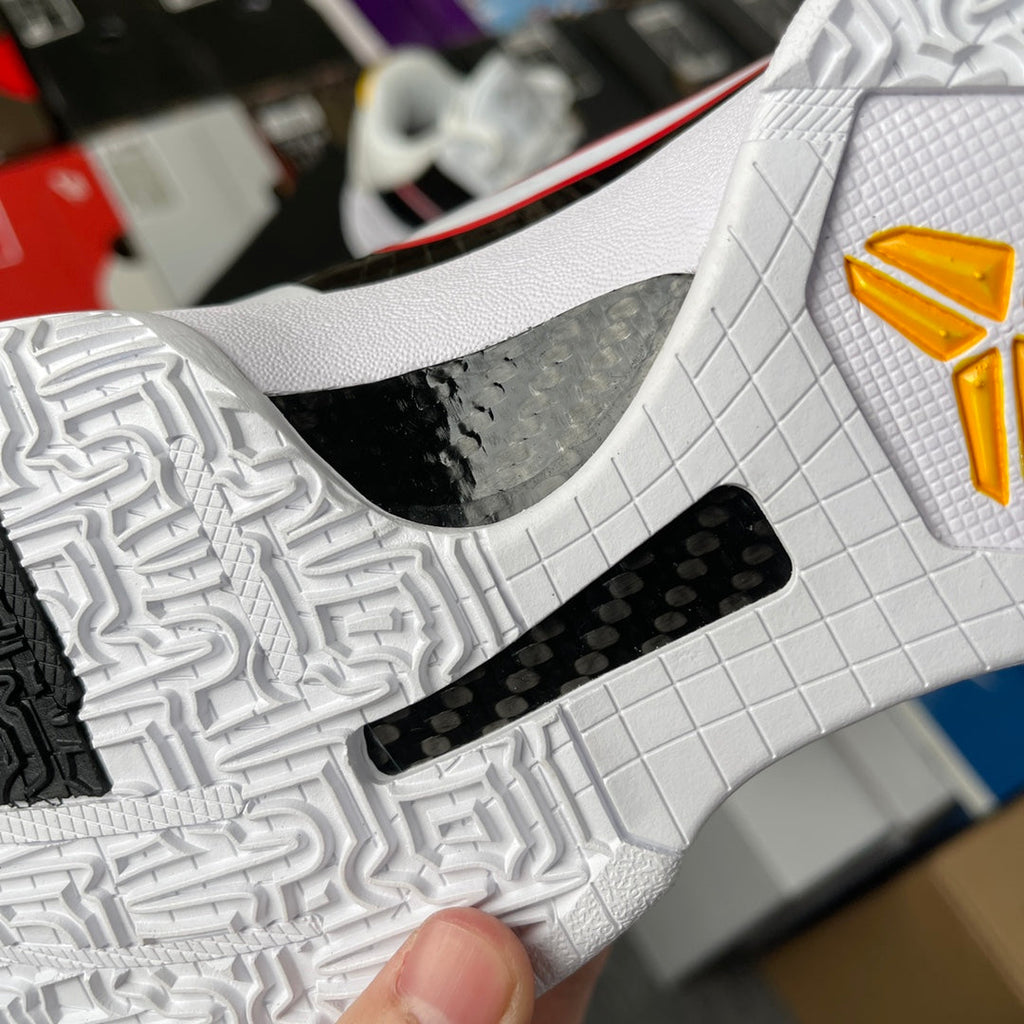 Nike Zoom Kobe 5 Protro basketball shoe, close-up of white outsole with black rubber inset