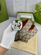 Gucci belt in box view, beige GG canvas with red strap and silver G buckle
