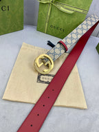 Logo-print belt with red leather strap and gold-tone round buckle, full length