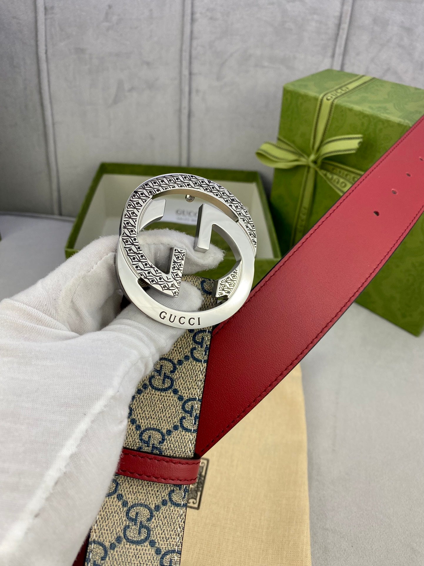 Logo-print belt buckle with silver-tone metal and red leather strap
