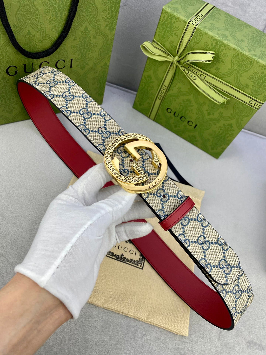 Logo-print belt with red leather strap and gold-tone circular buckle
