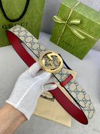 Logo-print belt with red leather strap and gold-tone circular buckle