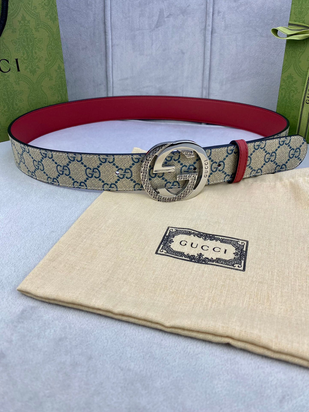 Logo-print belt with red leather trim and silver round buckle