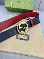 Gucci belt with dark leather and red underside, gold round double G buckle
