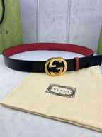 Gucci belt in dark leather with red edge and gold-tone double G buckle