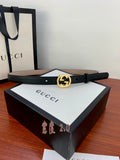 Gucci belt in dark leather with gold interlocking G buckle and metal pin holes