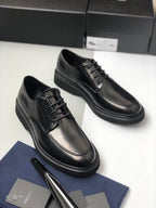 Prada unisex lace-up shoes, black leather, smooth toe caps and stitched panels