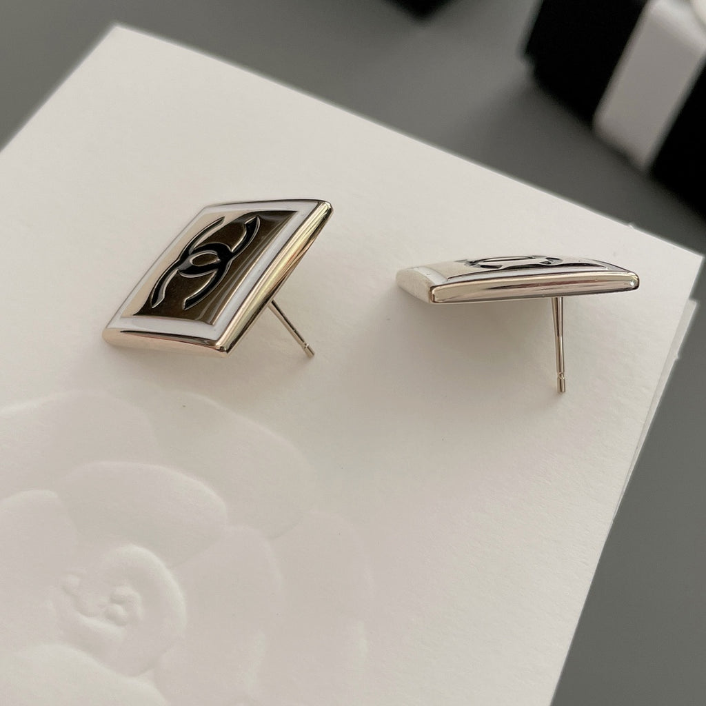 Chanel stud earrings side profile with square bezel and CC logo front
