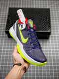 Navy and neon green basketball sneaker with blue laces and white sole, side view