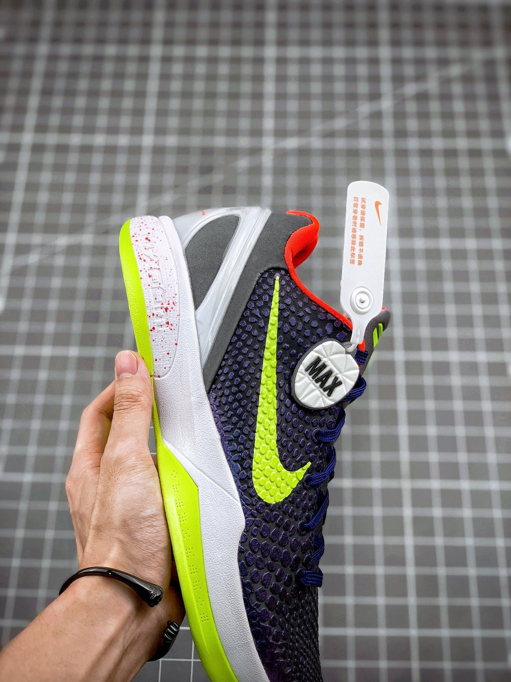 Navy basketball sneaker with neon green swoosh and 'MAX' logo on heel
