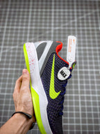 Navy basketball sneaker with neon green swoosh and 'MAX' logo on heel