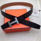 Black leather belt with gray H buckle and adjustable strap holes