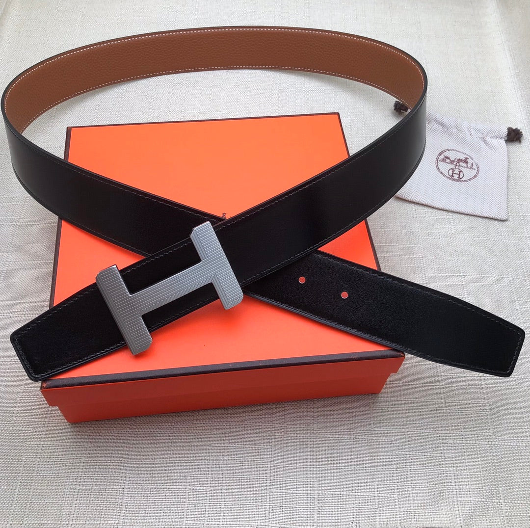 Black leather belt with gray H buckle and adjustable strap holes