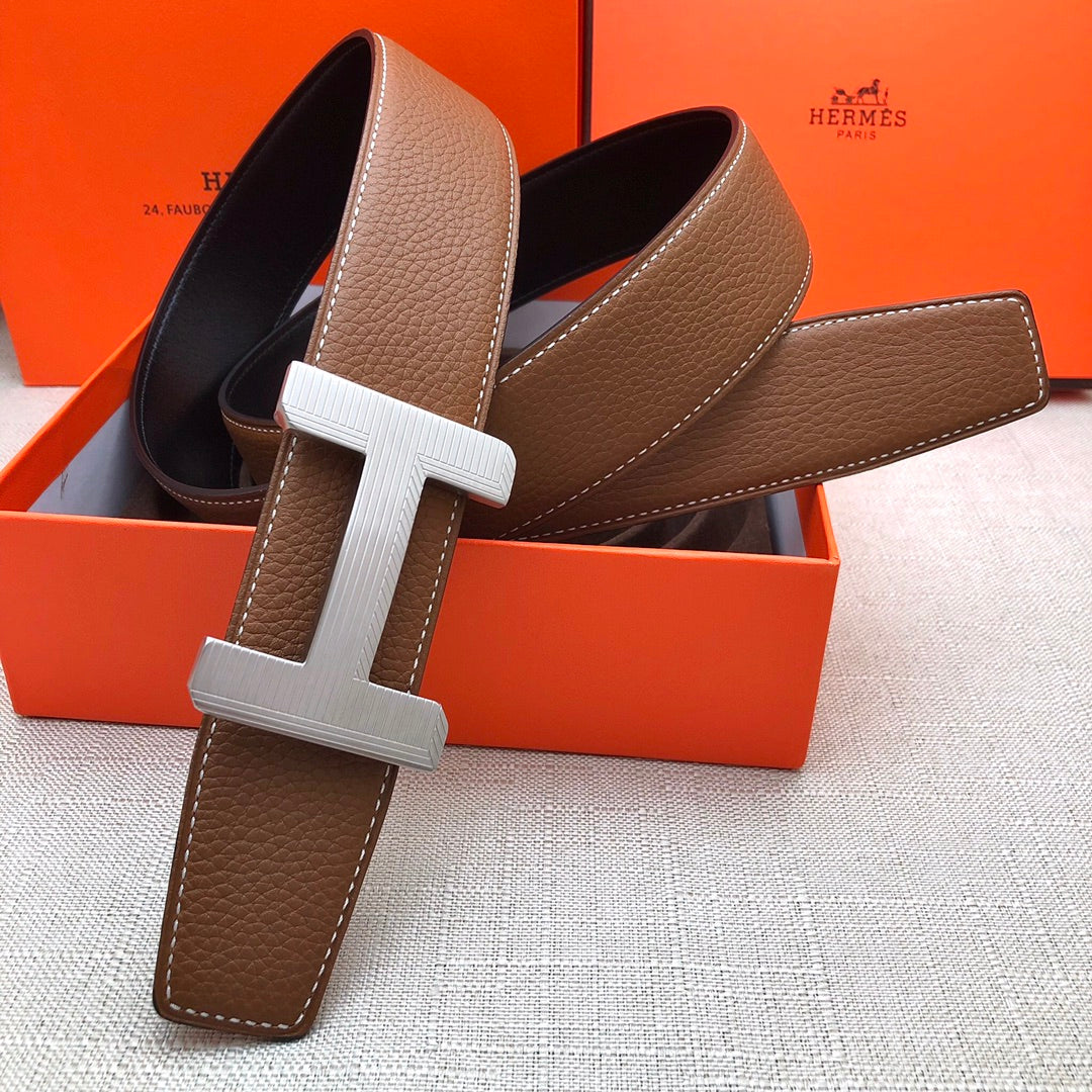 Brown leather belt with cream H buckle and dark interior lining