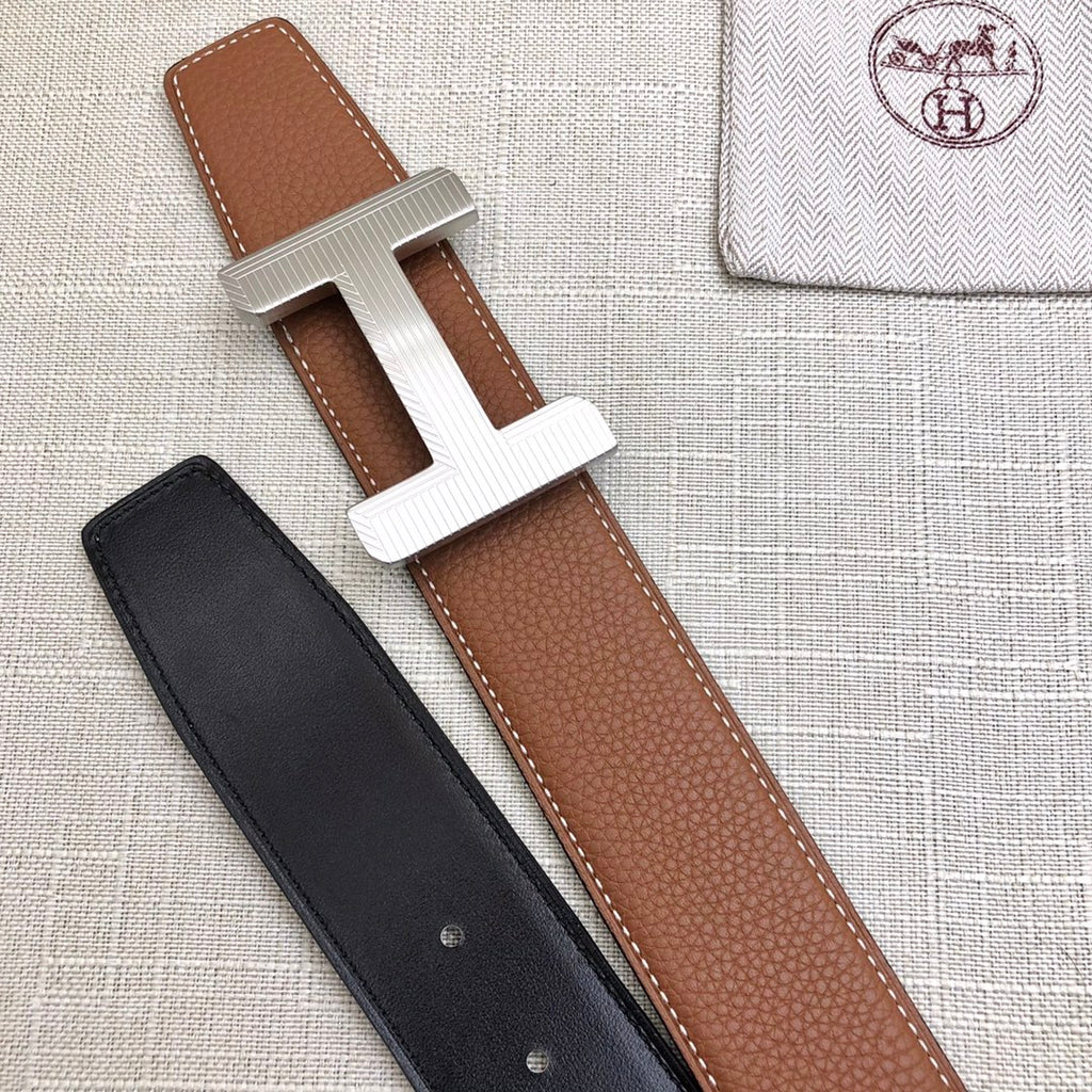 Brown and black leather belt straps with silver H buckle