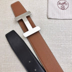 Brown and black leather belt straps with silver H buckle