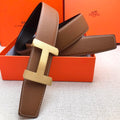 Brown leather belt with cream H-style buckle and visible strap holes