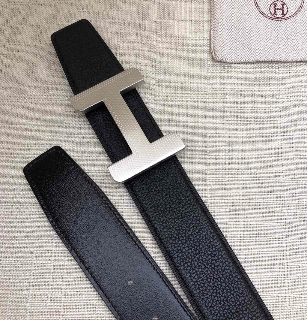 Hermes belt with silver-tone H buckle and matching dark leather strap