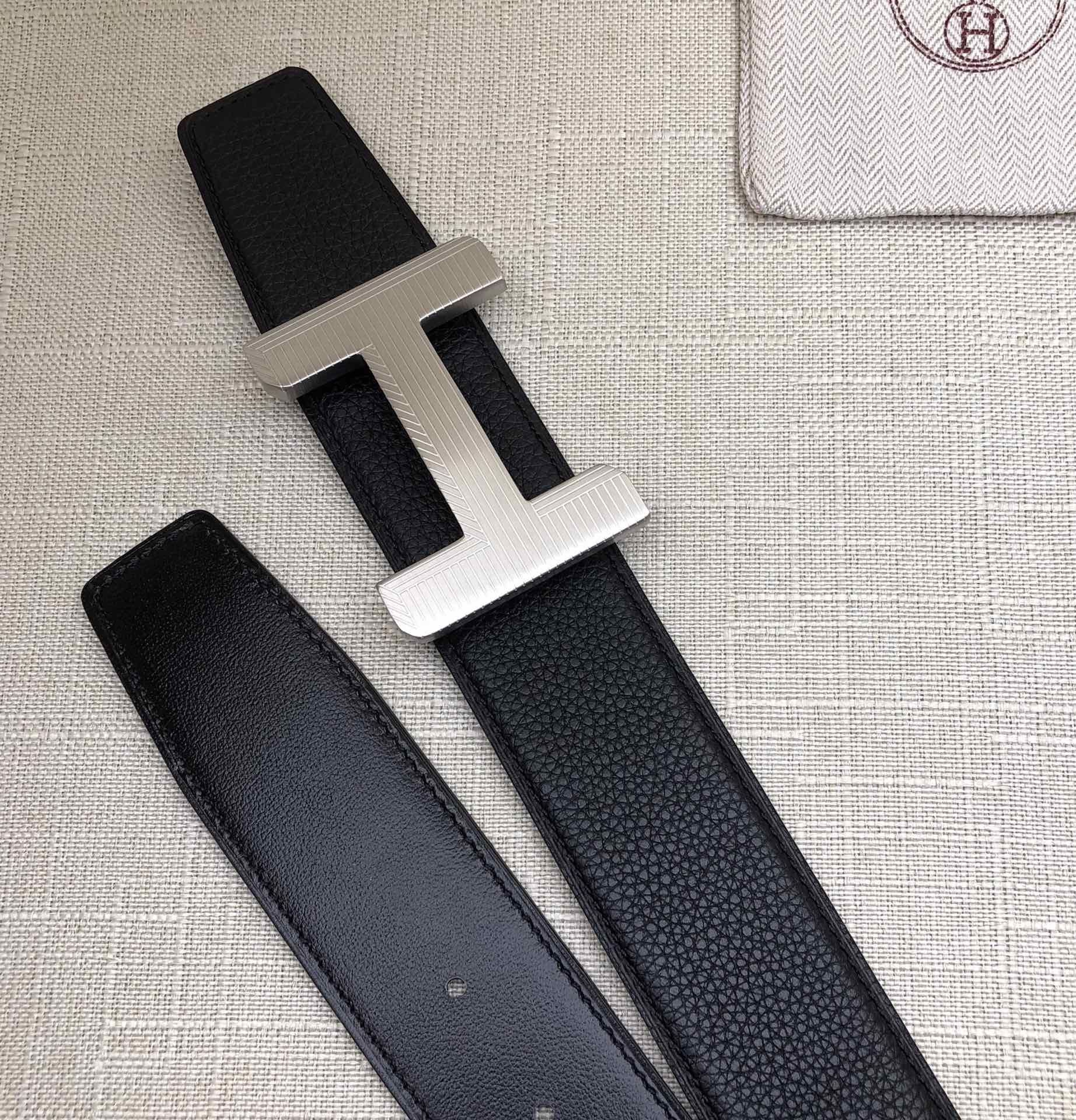 Hermes belt with silver-tone H buckle and matching dark leather strap