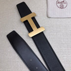 Hermes belt with gold-tone H buckle and matching dark leather strap