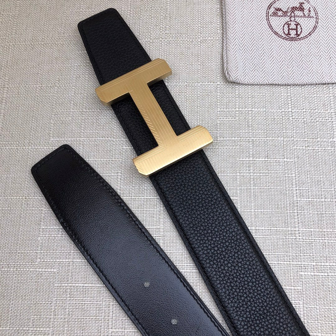 Hermes belt with gold-tone H buckle and matching dark leather strap