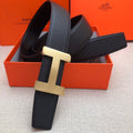 Hermes belt in dark leather with gold-tone H buckle and textured strap