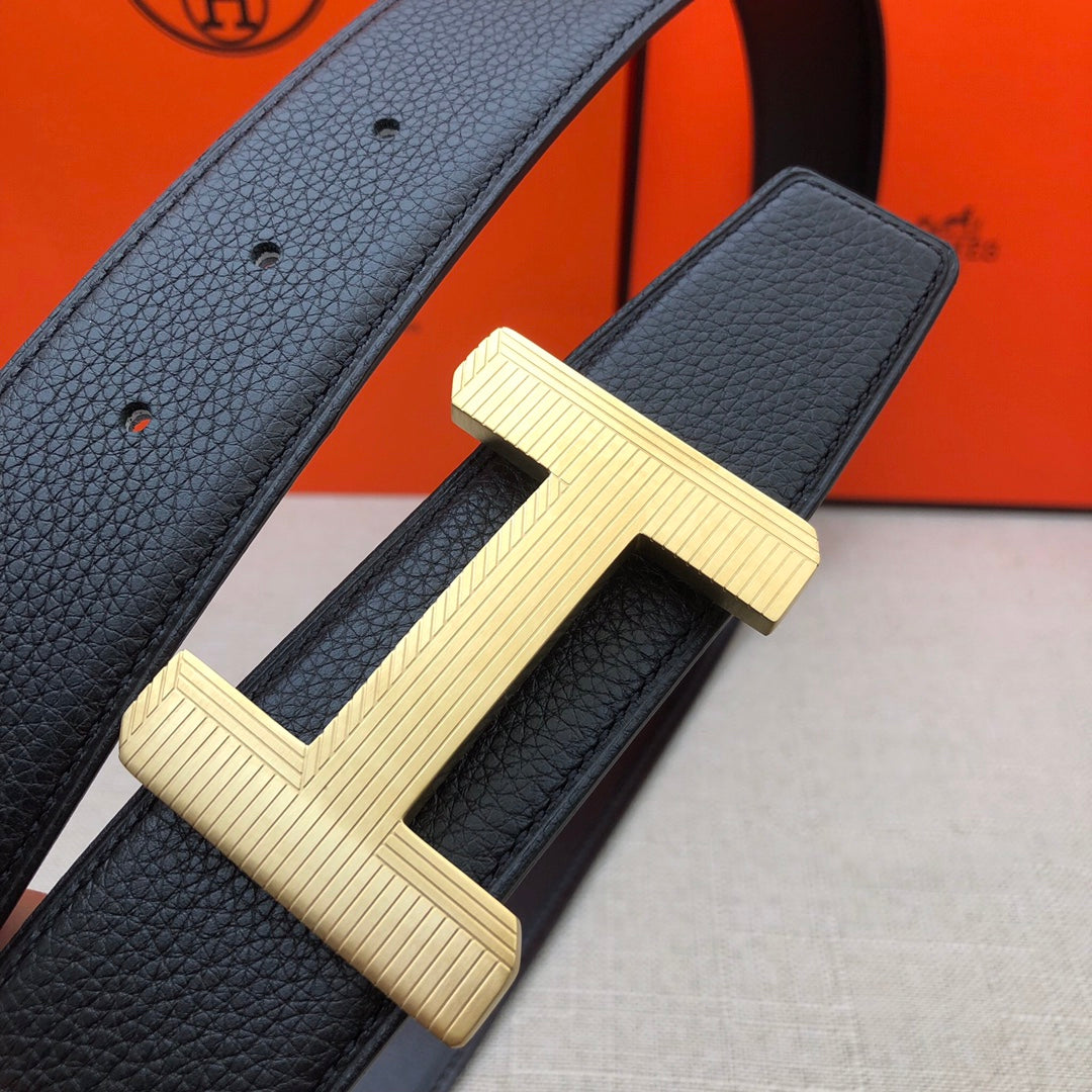 Hermes belt close-up: gold-tone H buckle on dark leather strap