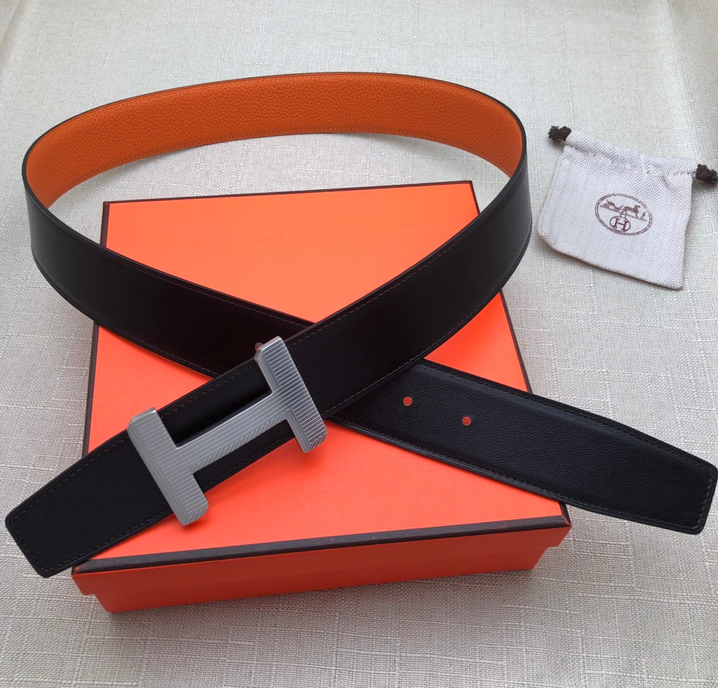 Hermes belt set with dark leather strap and silver buckle, plus matching pouch