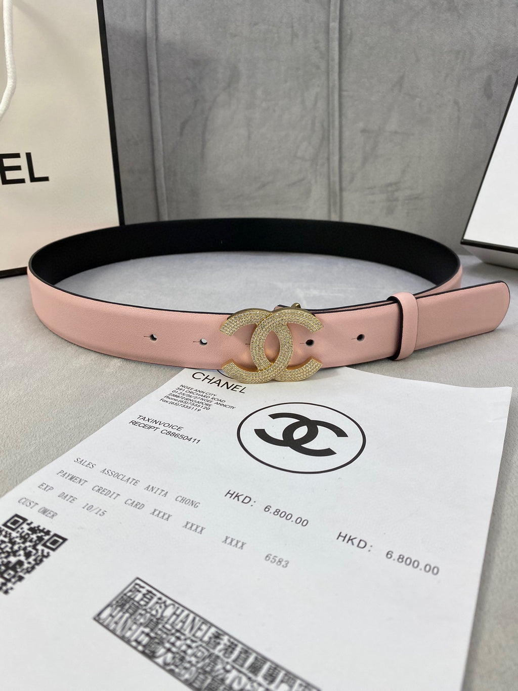 Chanel belt in light pink leather with gold-tone rhinestone CC buckle detail