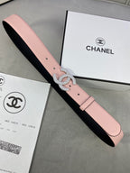 Chanel belt with light pink leather strap and rhinestone CC buckle on black lining