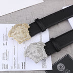 Black leather belt with gold- and silver-tone Medusa buckle medallions.