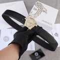 Black leather belt with gold-tone Medusa buckle, adjustable holes.