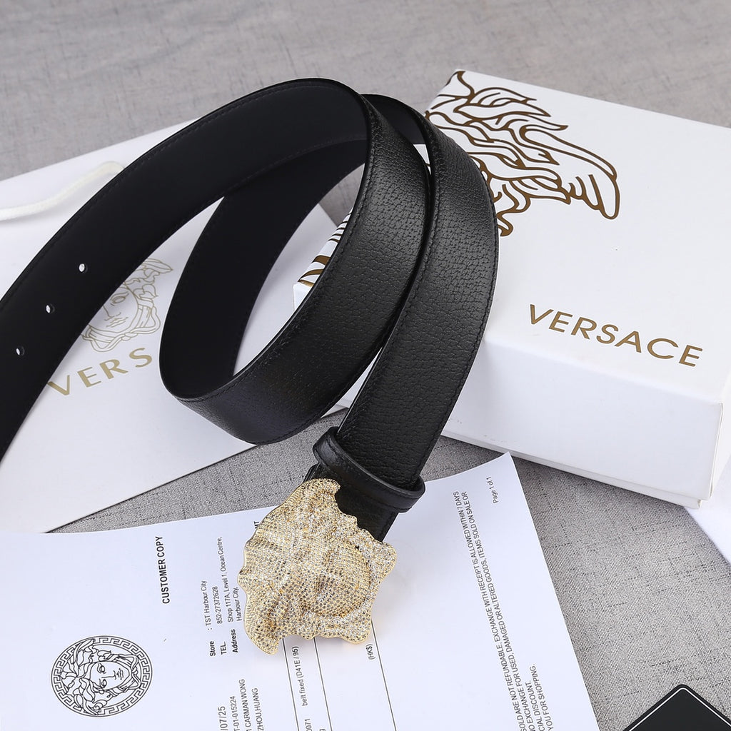 Black leather belt with gold-tone Medusa buckle, curved profile detail.