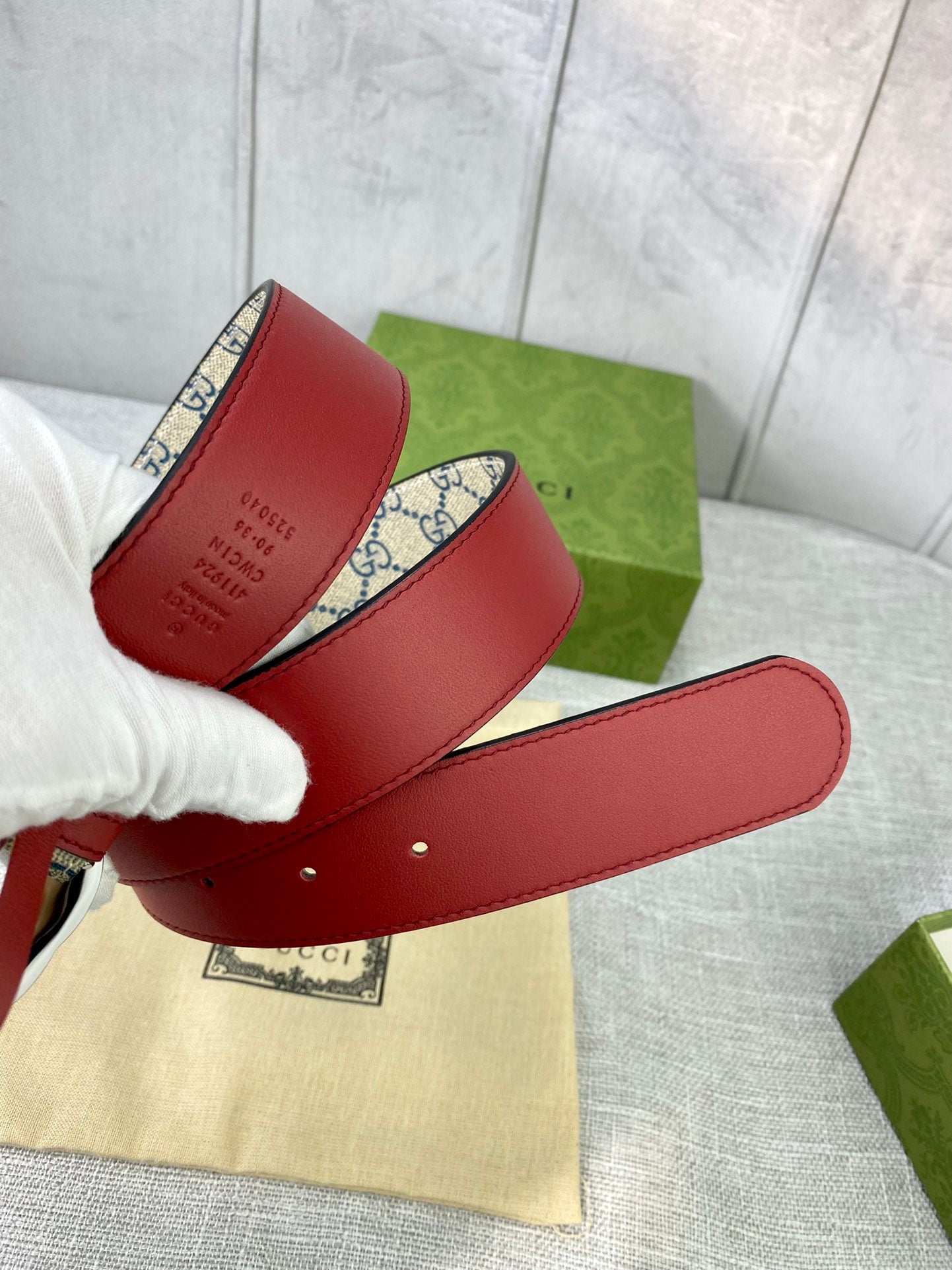 Red leather belt with GG canvas strap and gold-toned interlocking buckle