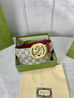 GG canvas belt with red leather edge and gold-toned interlocking buckle in box
