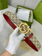 Gucci belt with GG canvas, red leather strap, round gold-toned interlocking buckle